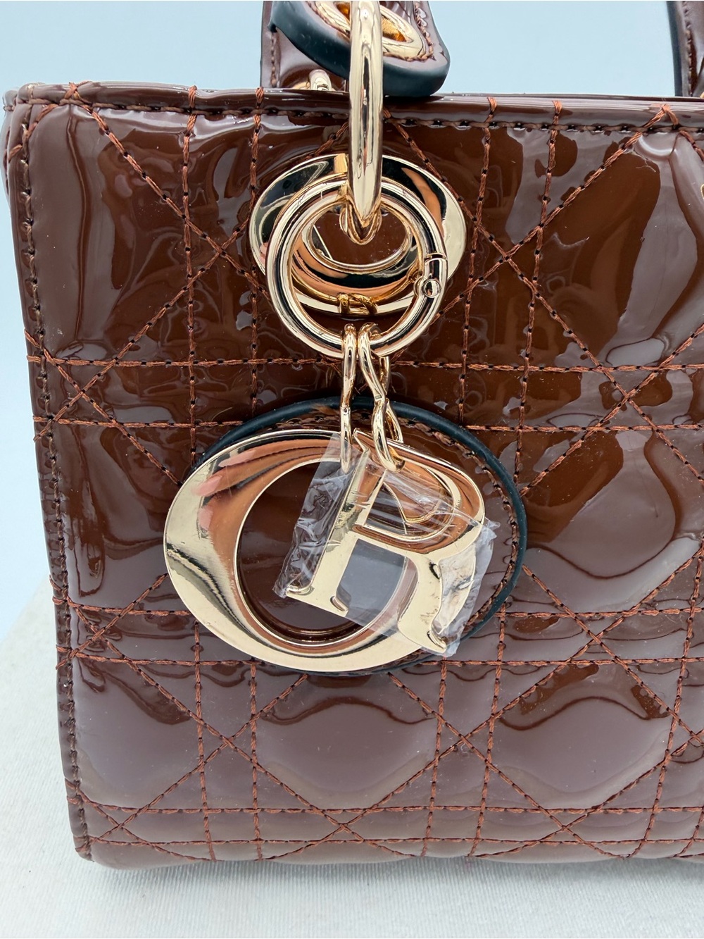 Beautiful, Brown Patent leather mini Bag with Gold Charm - Picture 5 of 15
